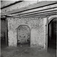 Black and White Photograph of Basement Fireplace