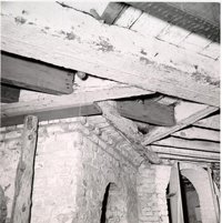 Black and White Photograph of Basement Ceiling