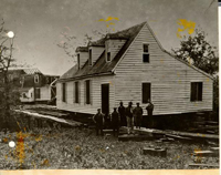 Above, the James Galt House, shown during its removal from the grounds of Eastern State Hospital to Block 13, Lot 354, on Duke of Gloucester Street, opposite Bruton Church. The operation was carried out during the first half of 1929.