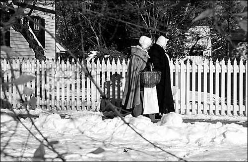 Women walking through the snow.