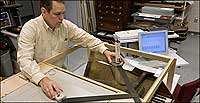 Conservator John Watson of Colonial Williamsburg uses a laser to computer-map a period keyboard instrument.