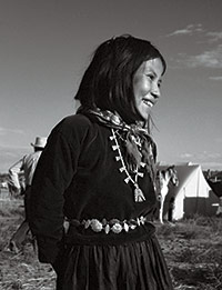 A Navajo girl shows off a Thunderbird necklace.