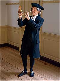 Interpreter Stephen Moore with a <i>shofar,</i> the ram's horn whose blasts ring out on Rosh Hashanah, the New Year's celebration.