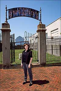 Bonnie Eisenman of the Beth Ahabah Museum stands in front of the oldest active Jewish cemetery of the South in Richmond.