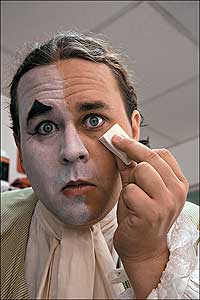 Kevin Ernst applies makeup.