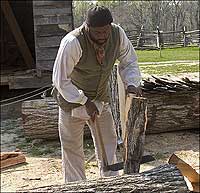 Robert Watson splits firewood with a froe.