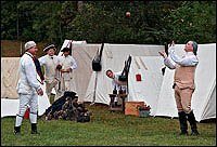 Games with balls and bats were favored recreations among soldiers during the
Revolution. General Washington, here Ron Carnegie, played catch with his officers, from left, Dale Smoot, Justin Chapman, Tom DeRose, and Stewart Pittman.