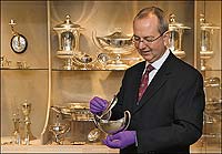 Ken Wolfe with the Kirby silver collection in the DeWitt Wallace Decorative Arts Museum—more than 1,000 pieces of plate silver.