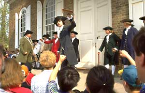 Interpreter David Tarleton, portraying a member of revolutionary Virginia's Committee of Safety, fills the ears of an audience of Courthouse visitors with some well-chosen eighteenth-century words on the perfidy of Lord Dunmore