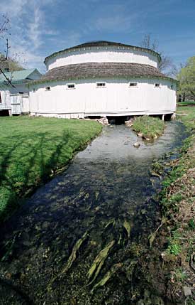 The men’s bathing pool at Warm Springs, unusual for its circular shape, shares the spring that feeds this stream.