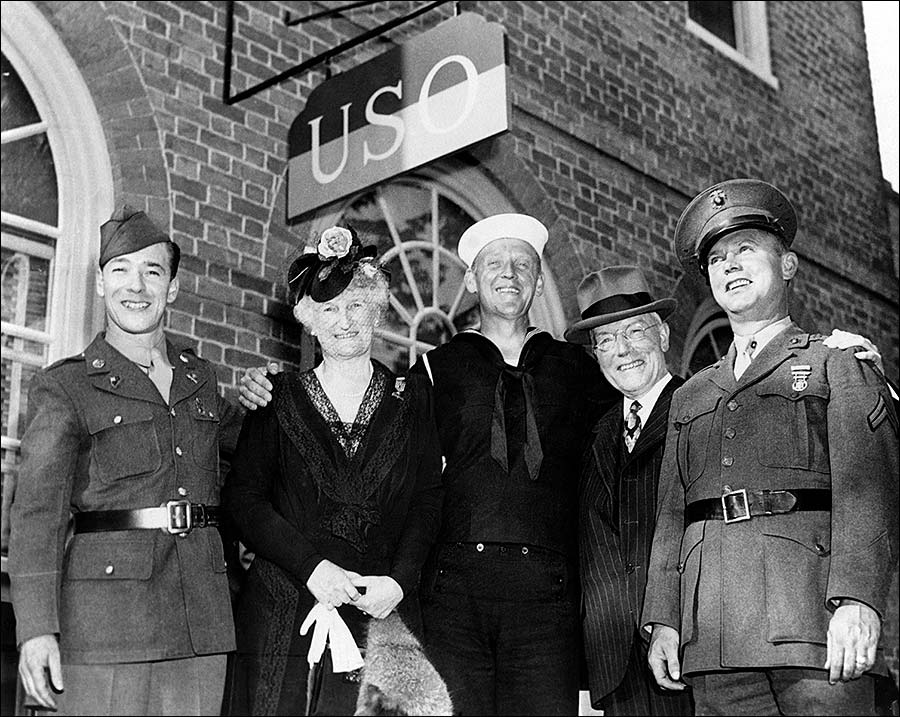 Photo of Mr. and Mrs. John D. Rockefeller Jr. with Soldiers at Opening of Williamsburg USO, May 1943. 