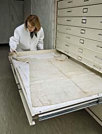 Linda Baumgarten, curator of textiles, examines a shift—body linen—in Colonial Williamsburg’s collections.