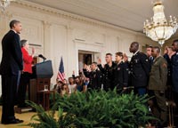 President Obama with new military citizens.