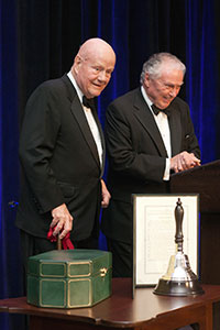 Forrest E. Mars Jr., left, accepts the Churchill Bell from President Colin G. Campbell.
