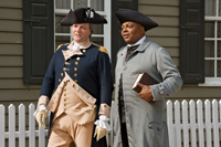 George Washington, portrayed by Ron Carnegie, and Gowan Pamphlet, interpreted by James Ingram, are seen together in Williamsburg.