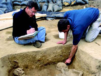 Doug Owsley takes notes on the excavation of a double burial found at Jamestown Fort.