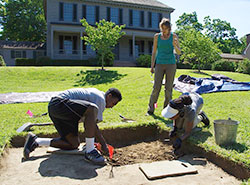 Archaeological field school students excavate the terraced eighteenth-century garden behind the Robert Carter House.