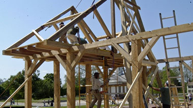 Workers reconstruct the Market House.