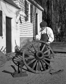 A wheelwright with a wheel.